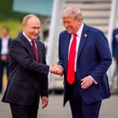 All smiles as Donald Trump greets Vladimir Putin in Anchorage, Alaska, ahead of a meeting last year. Picture: Andrew Harnik