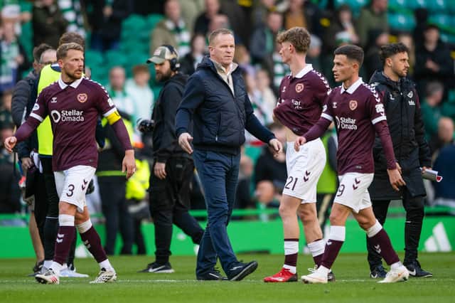 Hearts head coach Wouter Vrancken and his players after the defeat by Celtic.