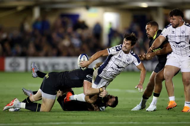 Montpellier's Adam Hastings offloads during the win over Bath.