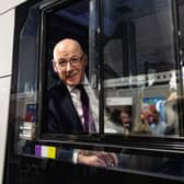 John Swinney in the driver's seat of a First Bus at a trade stand at the SNP party conference in Aberdeen. Picture: Paul Reid
