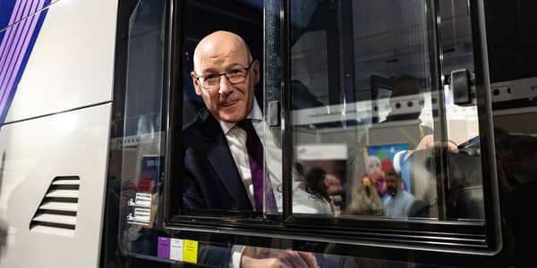 John Swinney in the driver's seat of a First Bus at a trade stand at the SNP party conference in Aberdeen. Picture: Paul Reid