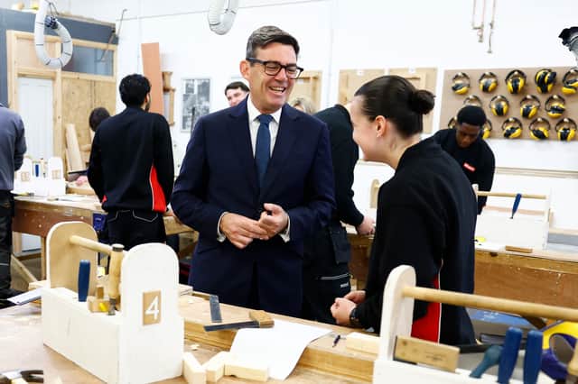 Andy Burnham speaks to a student during a visit to New College Lanarkshire's Motherwell Campus ahead of a speech focusing on the forming of closer ties with the Scottish government. Picture: Jeff J Mitchell