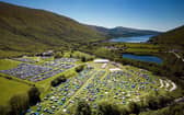 An aerial shot from 2022 shows how much the festival has grown as well as its stunning location.