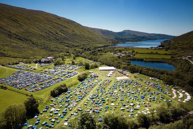 An aerial shot from 2022 shows how much the festival has grown as well as its stunning location.