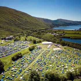 An aerial shot from 2022 shows how much the festival has grown as well as its stunning location.