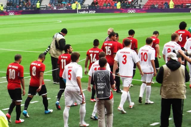 Mo Salah, wearing the red Egypt No 11 shirt, walks out at Hampden before the match against Belarus at the 2012 Summer Olympics. Picture: Andy Mitchell