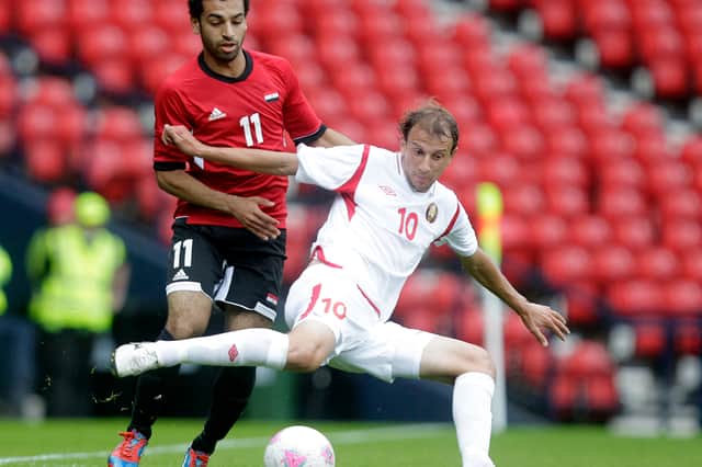 Egypt's Mohamed Salah (L) vies with Belarus' Renan Bardini Bressan (R) during the London 2012 Olympic Games men's football match at Hampden Park, Glasgow, Scotland, on August 1, 2012.