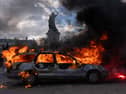 A car ablaze during demonstrations in Paris at the weekend