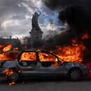 A car ablaze during demonstrations in Paris at the weekend