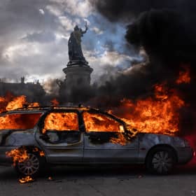 A car ablaze during demonstrations in Paris at the weekend