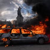 A car ablaze during demonstrations in Paris at the weekend