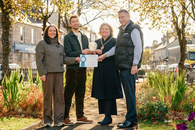 Television presenter Sean Batty, second left, and Kimberley Guthrie of Scotland's Towns Partnership, far left, presented the trophy to Provost of Aberdeenshire Judy Whyte and Derek Ritchie, manager of We Are Inverurie Business Improvement District