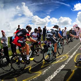 Picture by Simon Hulme/YPN - 06/07/2014 - Cycling - Tour de France 2014: Stage 2, York to Sheffield - Yorkshire, England - Crowds cheer on the cyclist's as they head up the gruelling Holme Moss Climb, Holme Moss Dale, West Yorkshire in the Yorkshire Grand Depart of the 2014 Tour de France. 6th July 2014 -  Cycling fans spectators, flags line the route -

The Grand Depart of the Tour de France 2027 and The Grand Depart of the Tour de France Femmes avec Zwift 2027. Both Races will start in the United Kingdom and visit Scotland, Wales and England - ALL IMAGES © www.SWpix.com ( Photography Hub Ltd ) from the SWpix.com photography archive - MANDATORY BYLINE/PHOTO CREDIT to Photographers Name/SWpix.com/LeTourGB (strictly editorial use only - contact for commercial - simon@swpix.com )
