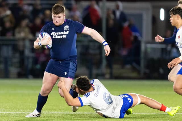 Ollie Blyth-Lafferty, playing for Scotland Under-20s, takes on France's Marceau Marzullo during an U20 Six Nations match at Hive Stadium, on March 6, 2026.
