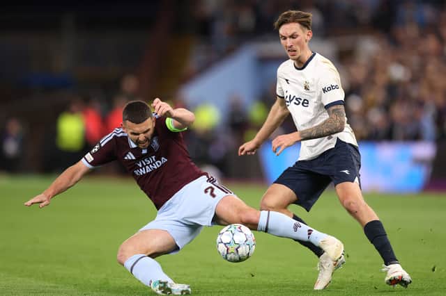 McGinn is challenged by Kristoffer Askildsen of Viking on Wednesday night at Villa Park.