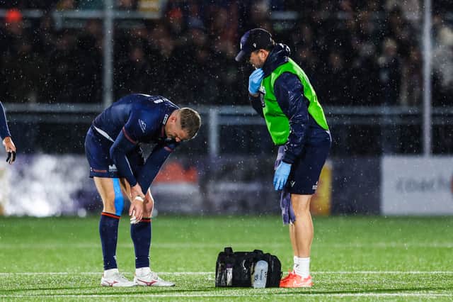 Edinburgh's Duhan van der Merwe picks up an injury and is substituted during the win over Lions at Hive Stadium. (Photo by Ewan Bootman / SNS Group)