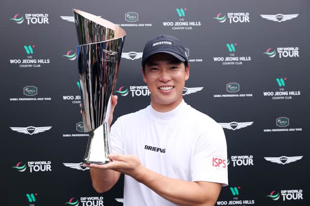 Japan’s Yuto Katsuragawa shows off the trophy after winning the Genesis Championship at Woo Jeong Hills Country Club in Cheonan, South Korea 