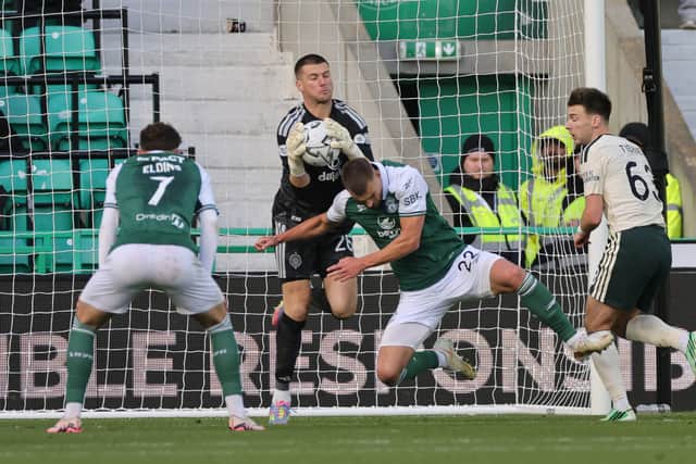 Celtic goalkeeper Sam Johnstone saves from Hibernian's Callum Wright
