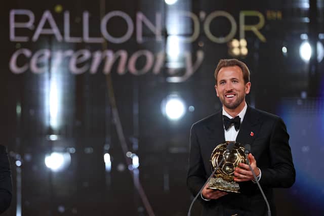 England and Bayern Munich forward Harry Kane receives the 2026 Ballon d'Or award at the Palladium Theatre in London. (Photo by FRANCK FIFE / AFP via Getty Images)