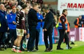 Hearts head coach Wouter Vrancken and his Rangers counterpart Derek McInnes shake hands after the game.