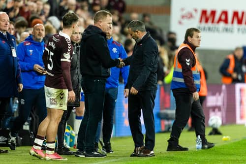 Hearts head coach Wouter Vrancken and his Rangers counterpart Derek McInnes shake hands after the game.