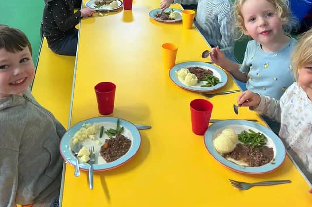 Pupils enjoying a venison mean at Lochaline Primary