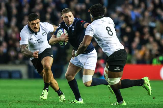 Finn Russell on the attack against New Zealand during the 2025 match at Scottish Gas Murrayfield. The All Blacks won 25-17.