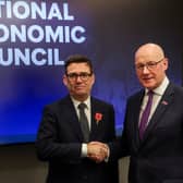 Prime Minister Andy Burnham and First Minister John Swinney shake hands ahead of a bilateral meeting at the National Economic Council in Glasgow