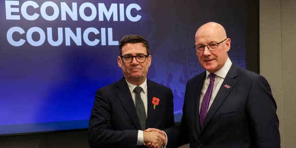 Prime Minister Andy Burnham and First Minister John Swinney shake hands ahead of a bilateral meeting at the National Economic Council in Glasgow