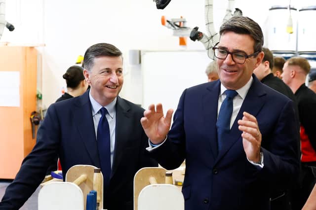 Prime Minister Andy Burnham, right, is accompanied by Secretary of State for Scotland Douglas Alexander during a visit to New College Lanarkshire's Motherwell Campus ahead of a speech focusing on the forming of closer ties with the Scottish government