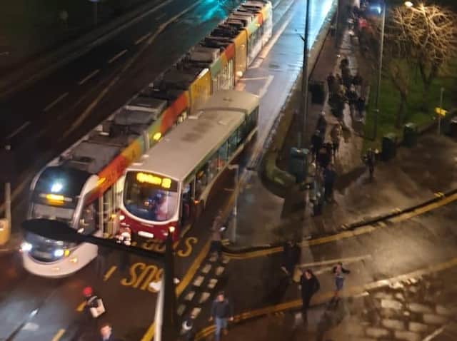 A bus and tram have collided in Edinburgh's West End this evening.