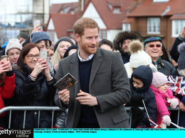 Huge crowds turned out to greet Prince Harry when he visited Edinburgh Castle with Meghan Markle in February 2018.