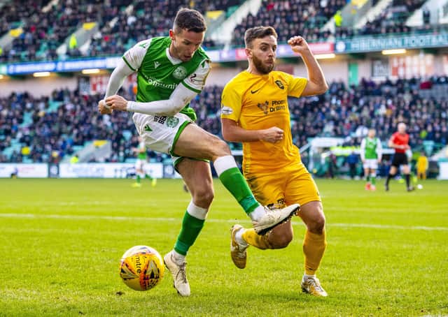 Hibs’ Stephen McGinn and Livingston’s Steven Lawless. Picture: SNS