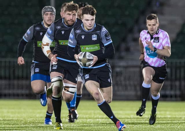 Jamie Dobie makes a break during Glasgow Warriors' victory over Dragons. Picture: SNS/SRU.
