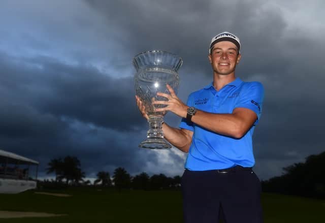 Viktor Hovland of Norway poses with the trophy on the 18th green after winning the Puerto Rico Open at Grand Reserve Country Club. Picture Jared C. Tilton/Getty Images