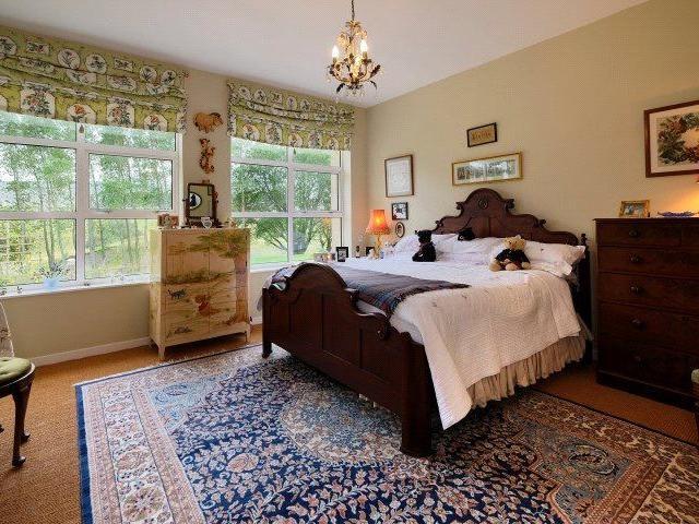 One of the four bedrooms.