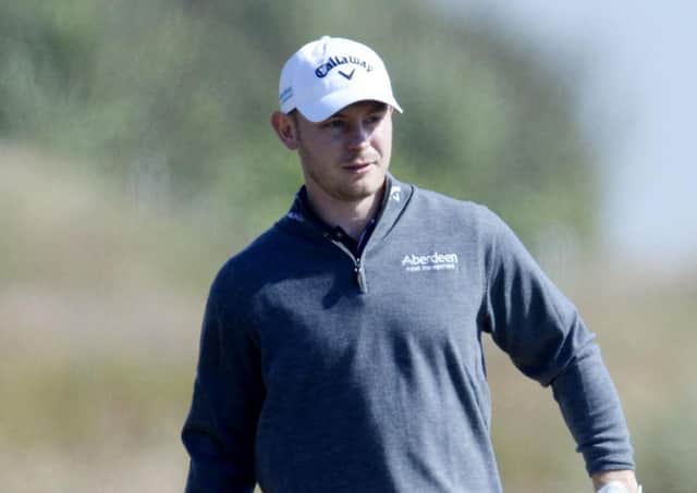 11/07/14 ABERDEEN ASSET MANAGEMENT SCOTTISH OPEN
ROYAL ABERDEEN GOLF CLUB
Scott Henry searches for his ball