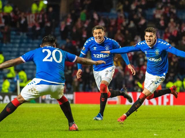 Alfredo Morelos, Ianis Hagi and James Tavernier celebrate Rangers' winner against Braga at Ibrox