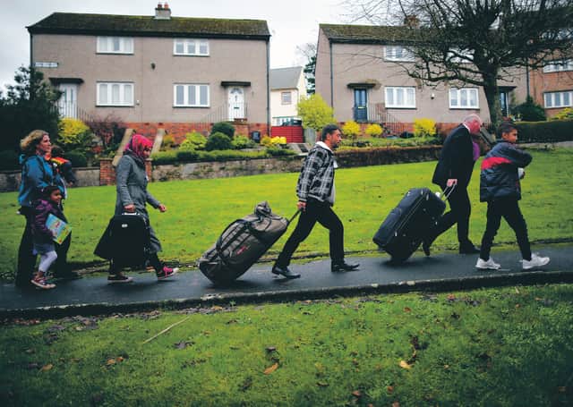 A refugee family arrives in Rothesay on the Isle of Bute. Picture: Christopher Furlong/Getty