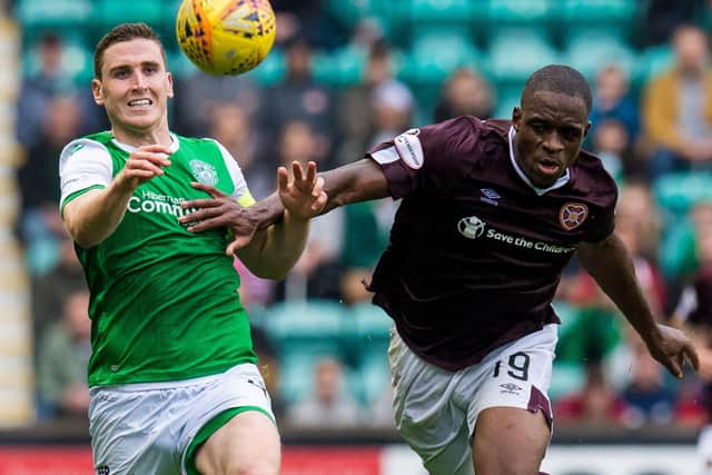 Hibs defender Paul Hanlon battles with Uche Ikpeazu of Hearts during the last Edinburgh derby at Easter Road. Picture: SNS