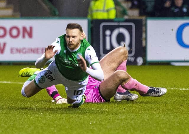 Martin Boyle goes down in the box. The Hibs winger was booked for diving. Picture: Paul Devlin / SNS Group