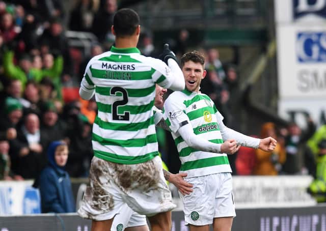 Ryan Christie celebrates with teammate Christopher Jullien (L) after scoring Celtic's winner against St Johnstone. Picture: SNS.