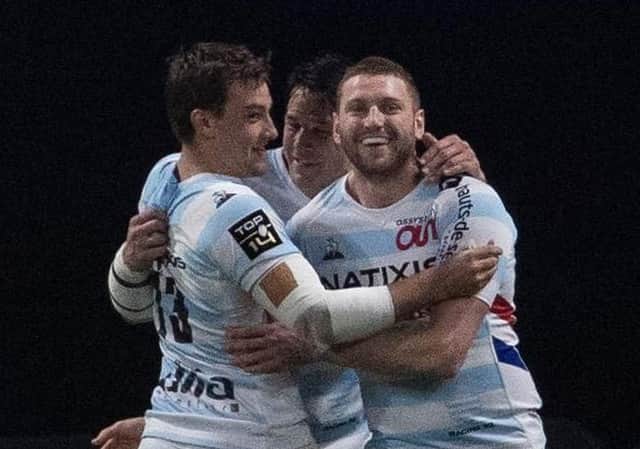 Finn Russell is congratulated by his team-mates after scoring a try for his French club Racing 92 against La Rochelle in the Top 14.