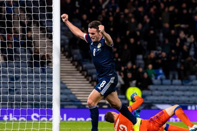 John McGinn celebrates after scoring against Kazakhstan. Picture: SNS