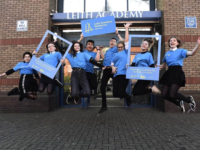Pupils from Leith Academy unveil the new branding for the school's partnership with the Edinburgh International Festival. Picture: Lisa Ferguson.