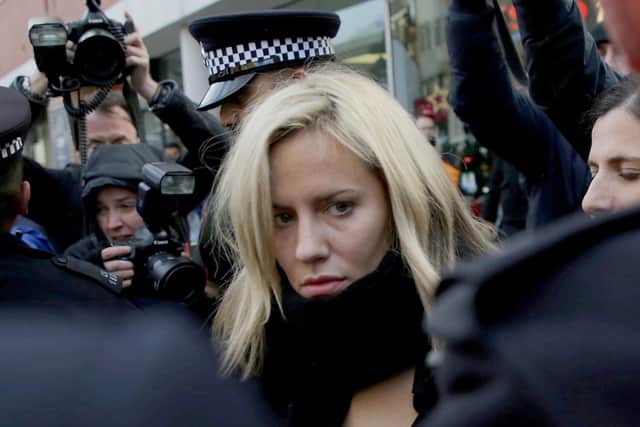 Police escort TV presenter Caroline Flack as she leaves Highbury Corner Magistrates Court in London (Picture: SWNS)