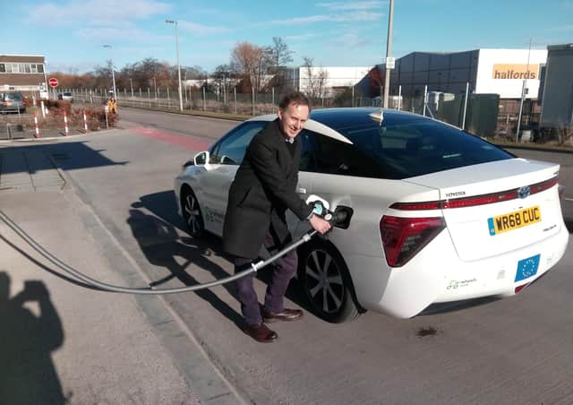 Alastair Dalton refuelling a Co-wheels Car Club Toyota Mirai car in Aberdeen. Picture: The Scotsman