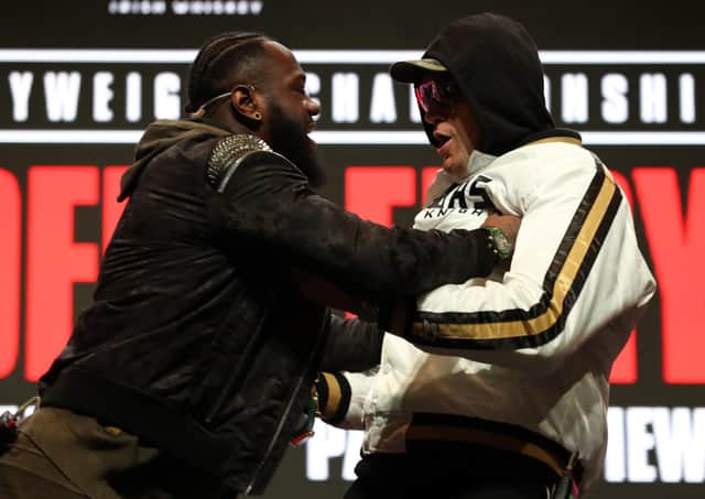Deontay Wilder and Tyson Fury confront each other on stage during the press conference at the MGM Grand Garden Arena ahead of Saturday’s world title fight. Picture: PA.