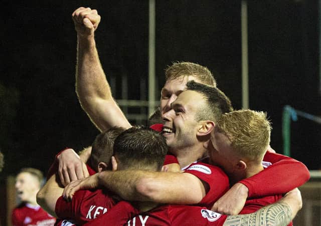 Andrew Considine leads the celebrations at Kilmarnock. Picture: Ross MacDonald/SNS