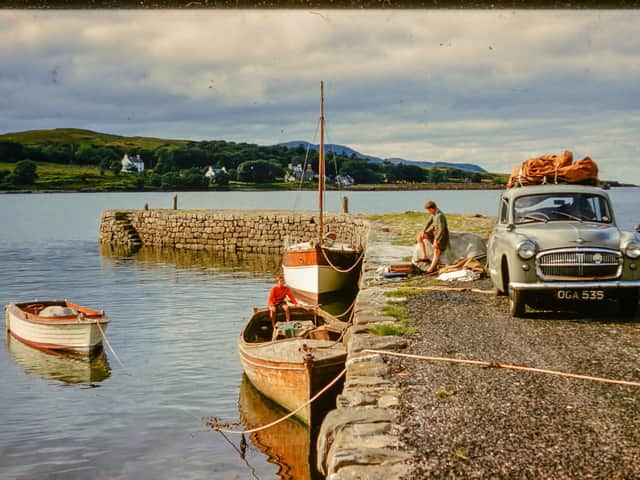 Playing on the jetty: two young Whatley boys get ready to sail to Pabay from the Skye mainland. PIC: Whatley Collection.
